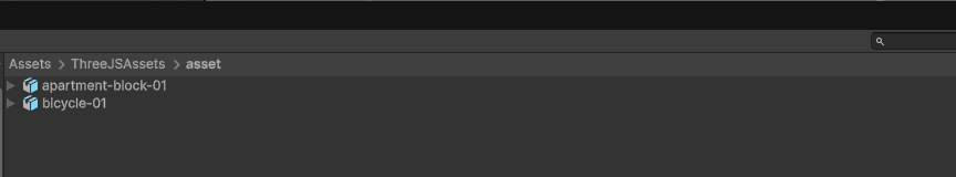The Unity Project window showing Assets > ThreeJSAssets > asset, containing imported models as ready-to-use prefabs.